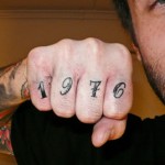 1976 finger tattoo
